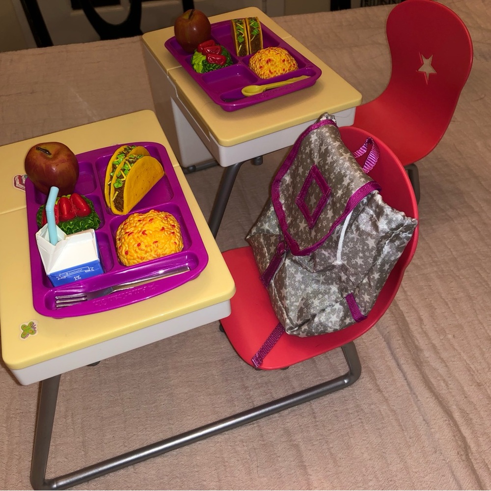 Two American Girl Flip-Top Desks, food, trays, and back pack.